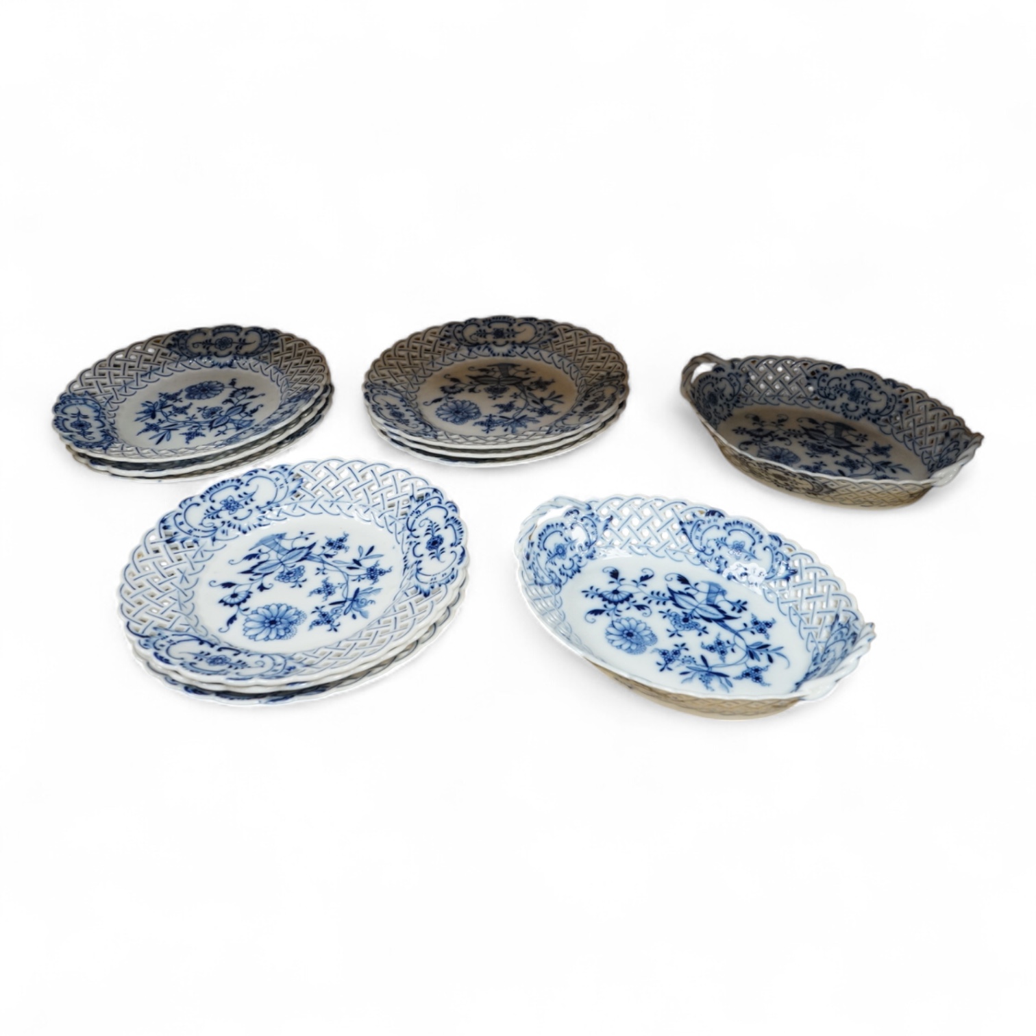 A ‘Meissen’ blue onion pattern dessert service comprising nine plates and two oval twin handled dishes, 24cm wide